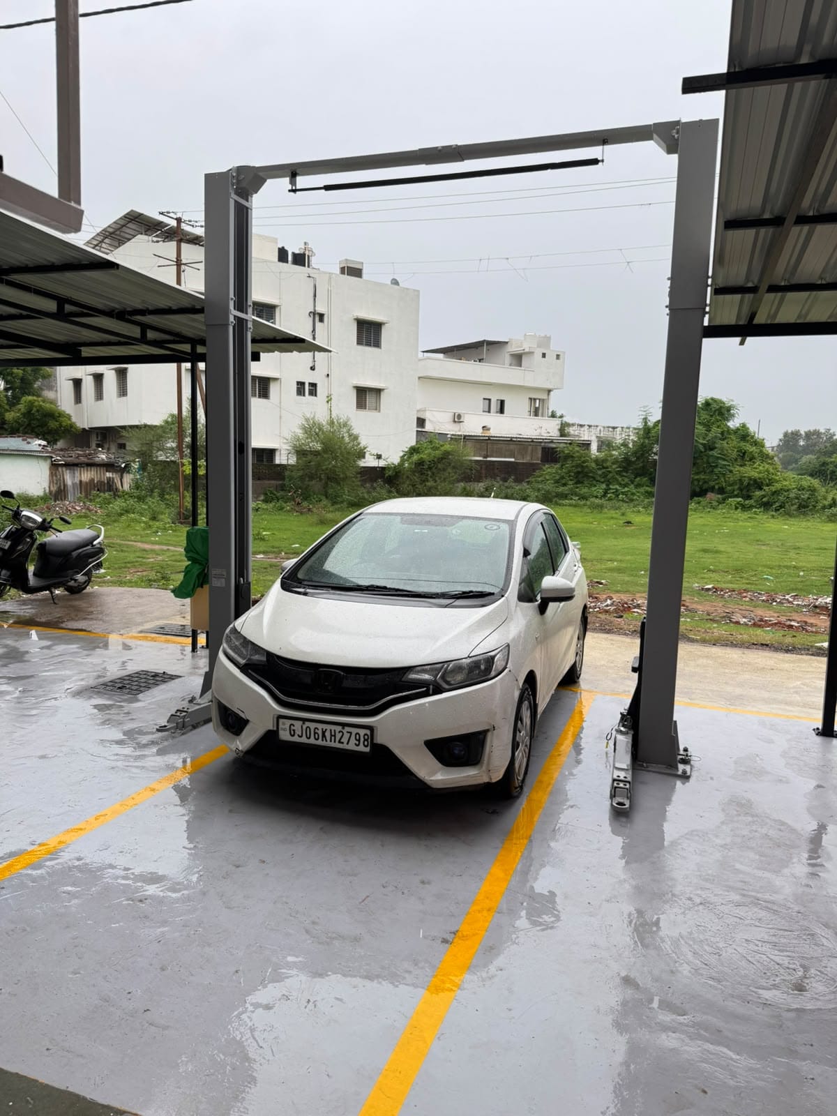 Car parked under the wash and service canopy